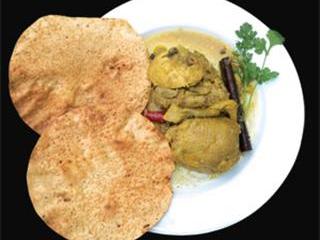 Curried chicken with coconut & papadum Curried chicken with coconut & papadum