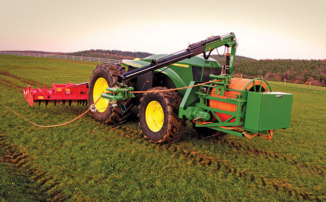 Electric tractor powered by a cable