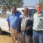From left: Muzi Hlongwana, Enoch Khumalo and Jurie Mentz in front of Khumalo’s bakkie, which he bought with the profits of his maize crop.