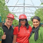 Louis-Gillis Janse van Rensburg (left, founder of Fresh Life Produce), Akhona Gxuluwe (production manager at HandPicked CityFarm), and Gouwa Waja (marketing manager at Kenilworth Centre) in one of the tunnels.