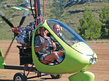 Garth Armstrong and a very happy Peter Goldsmith in his RAF 2000 gyrocopter in December 2003. 'I didn't want to get out of the thing,' he admits. 